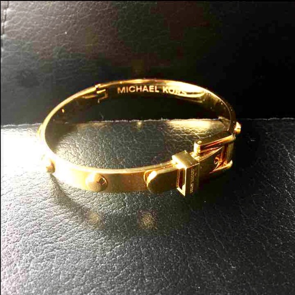 Gold Michael Kors Bracelet w/ belt buckle detail.