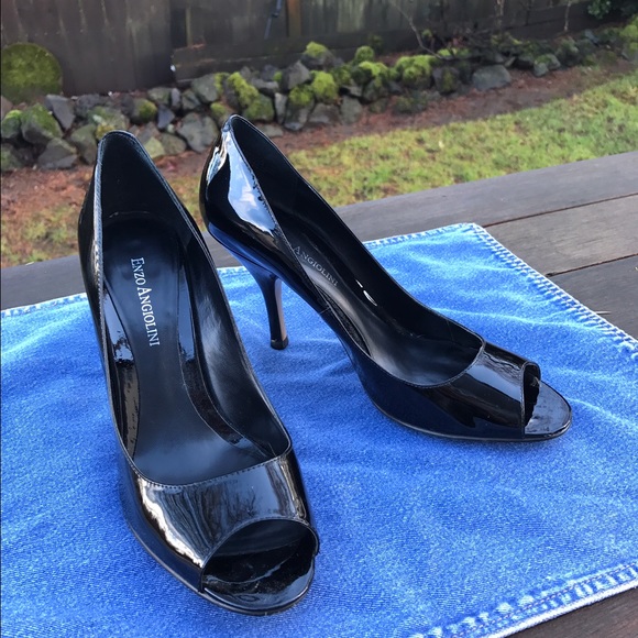Black patent leather peep toe pumps