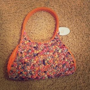Orange beaded purse.