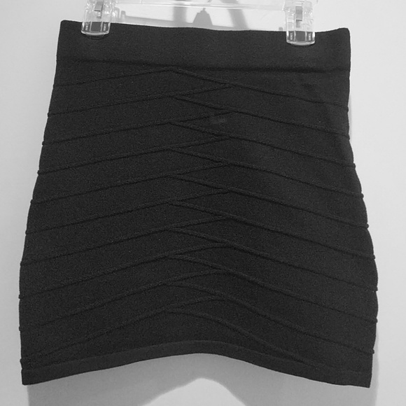 Knit black mini skirt with elastic waistband.