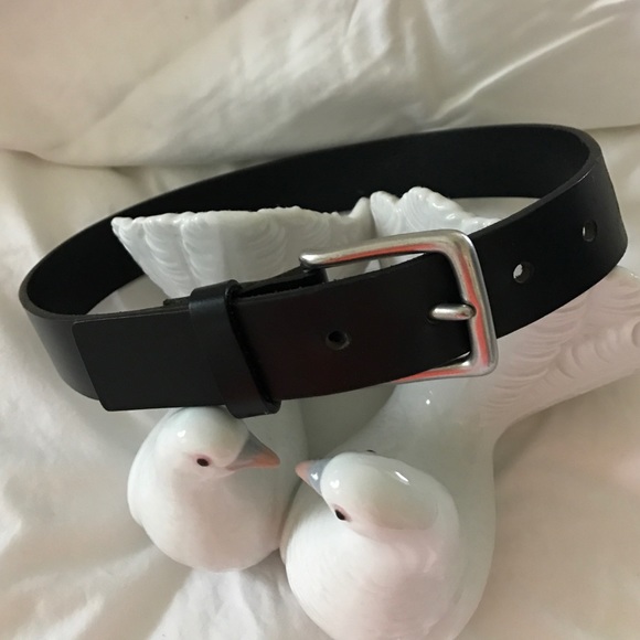 Black leather belt with silver buckle.