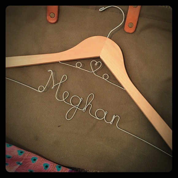 Engraved name wooden clothes hanger.