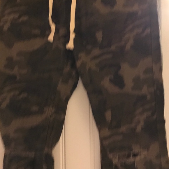 Fashion Nova Pants - Camo pants with the tore look .