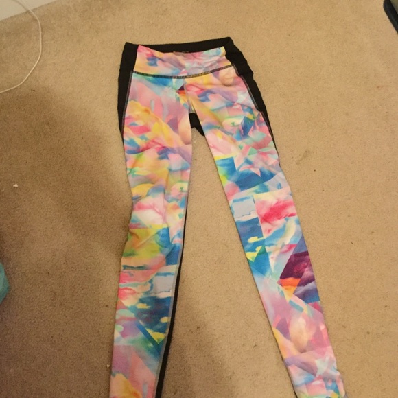 Colorful Lucy leggings the back of them is black.