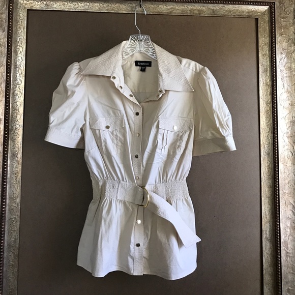 Short sleeve bebe snap blouse with attached belt.