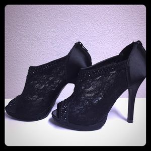 Black lace peep toe heels.