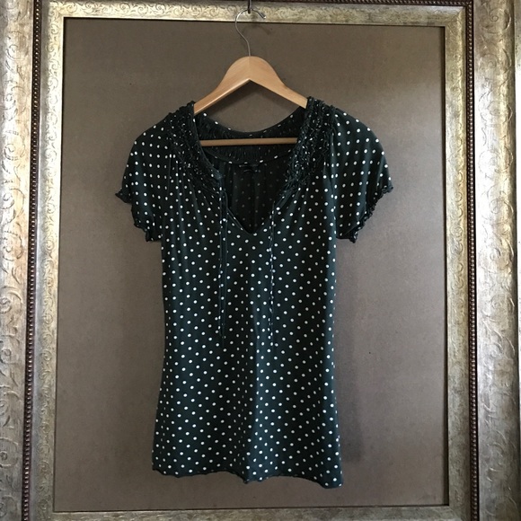 Hunter green and white polka dot blouse.