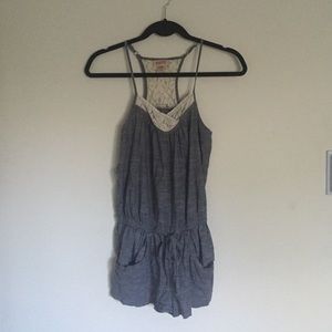 Spaghetti strap romper w/ lace detail and pockets!