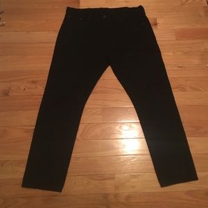 Levi's 501 CT black rinse jeans.