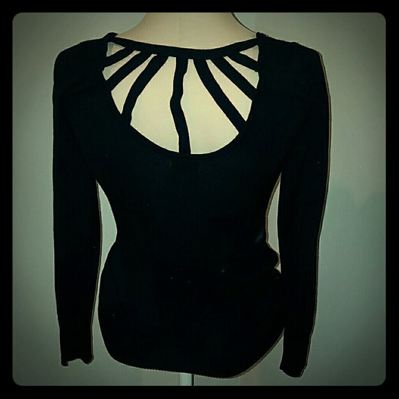 Black sweater with cage detailing on upper back