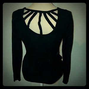 Black sweater with cage detailing on upper back