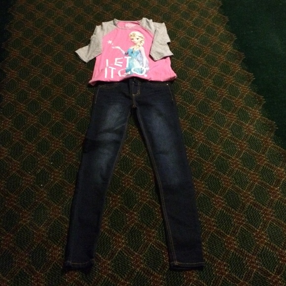 Pair of skinny jeans and Disney frozen shirt