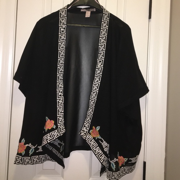 Black kimono with minimal designs on the edges