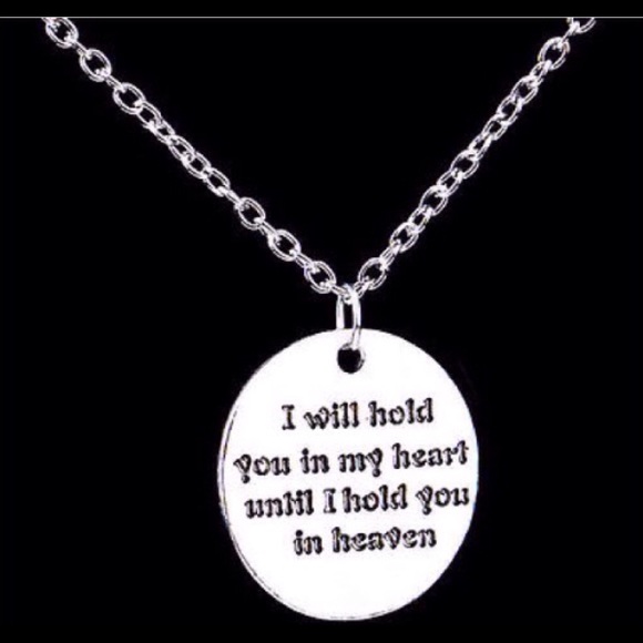 Silver "Remember Me" pendant.