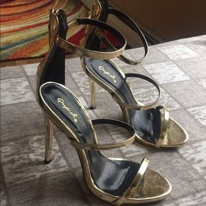 Gold Strap heels. Only worn once size 7