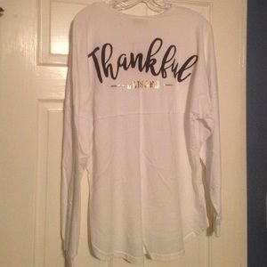 White long sleeve Thankful Blessed (on the back).