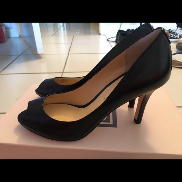 Ivanka Trump black peep toe pumps.