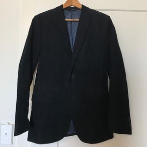 Men's navy blue corduroy blazer.
