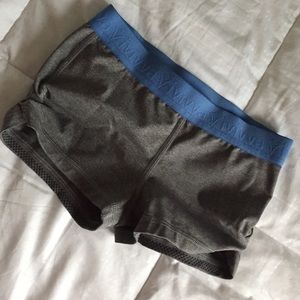 Girls booty shorts with blue waist band.