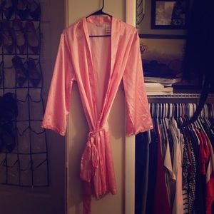 Pink robe with white polka dots