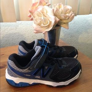 Boys new balance tennis shoes.