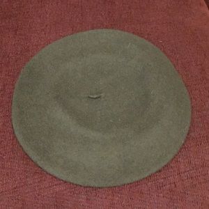 Wool dark olive green color beret.