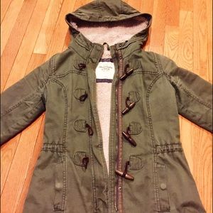 Forest green, fur lined, zip up jacket.