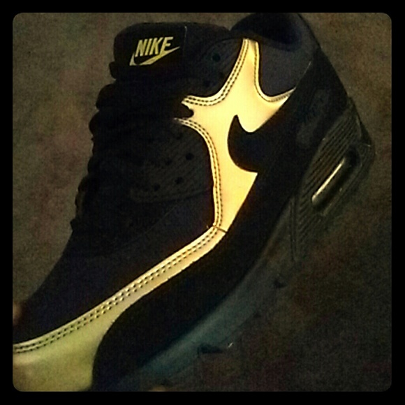 Black and gold nikes