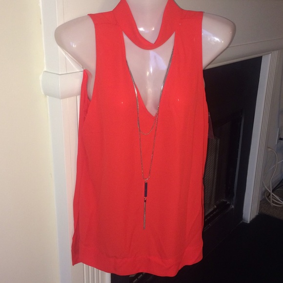 Sheer red sleeveless blouse