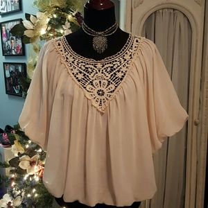 Cream blouse with lace neck detail
