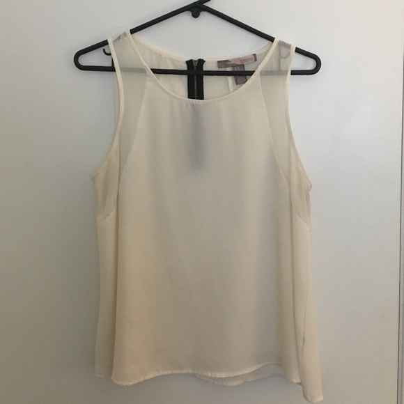 Cream tank with mesh lining on shoulders