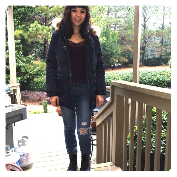 Navy Parka with a tan fur-trimmed hood