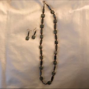 Gray necklace with matching earrings.