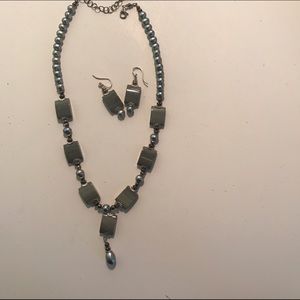 Gray necklace with matching earrings.