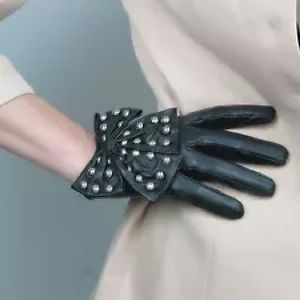 Fitted Black gloves with big bows and studs