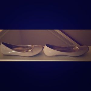 Nude colored Ballerina flats.