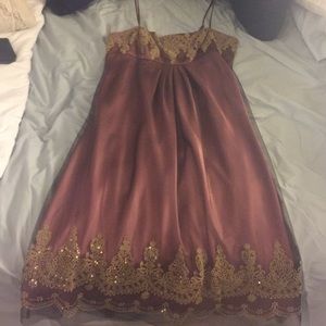 Dusty rose dress, black overlay and gold beading.