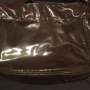 A brown patent coach