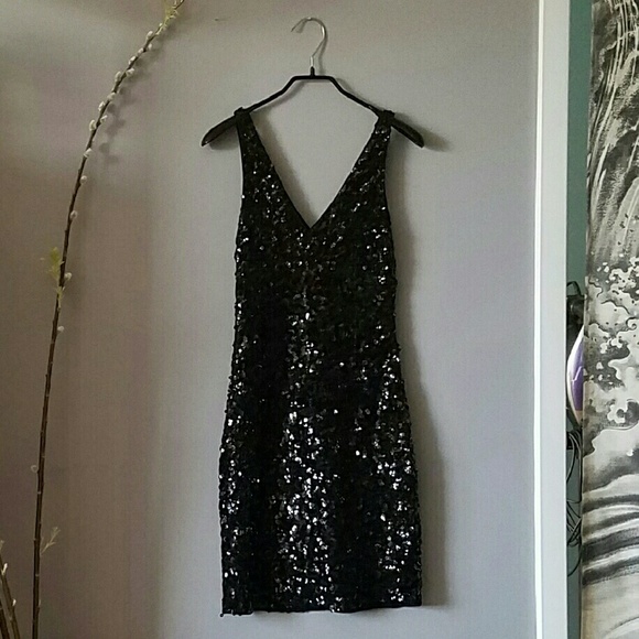 Fitted black sequin cocktail dress