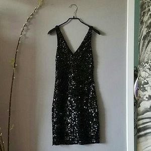 Fitted black sequin cocktail dress