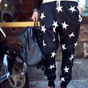 Black jogger pants with white stars