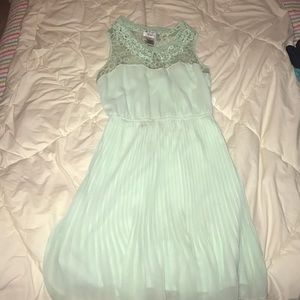A mint green, knee length dress