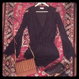 Black romper with lace bell sleeves