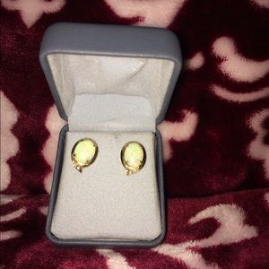 Opals set in gold with two diamonds.