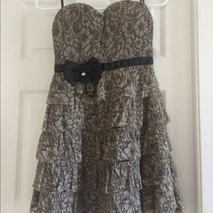 Cute lace ruffle dress with accent brooch