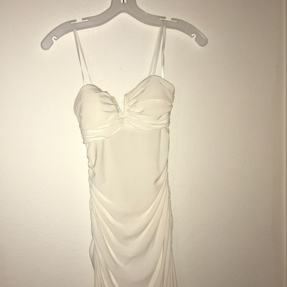 Tight white strapless formal dress