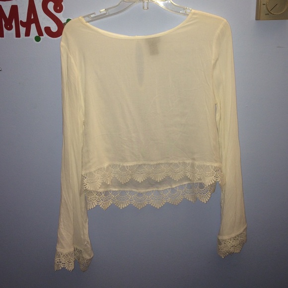 Bell sleeved longer crop top with lace detailing