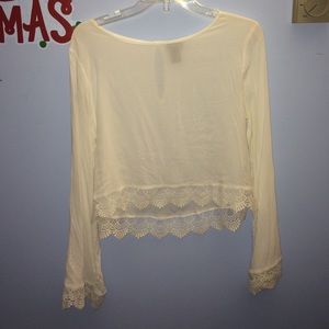 Bell sleeved longer crop top with lace detailing