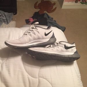 White/grey/black Nike free runs