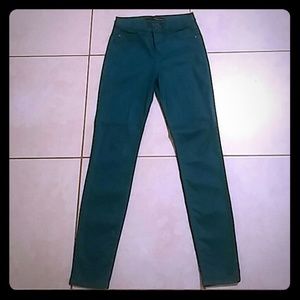 Sneak peek skinny matalic green jeans